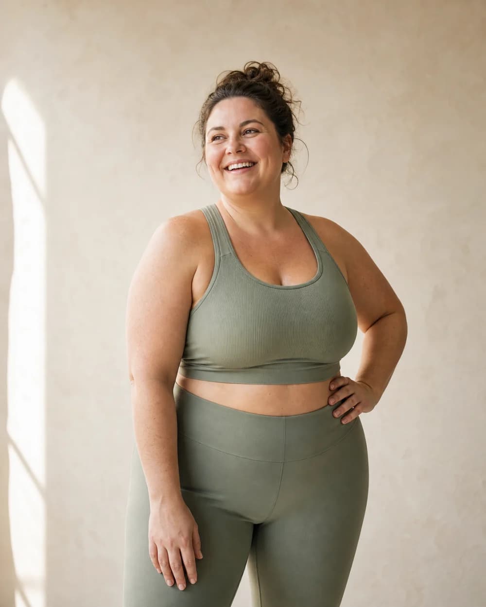 Adult in sage athletic clothing