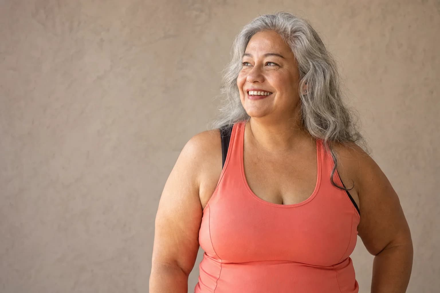 Adult woman in coral athletic clothing