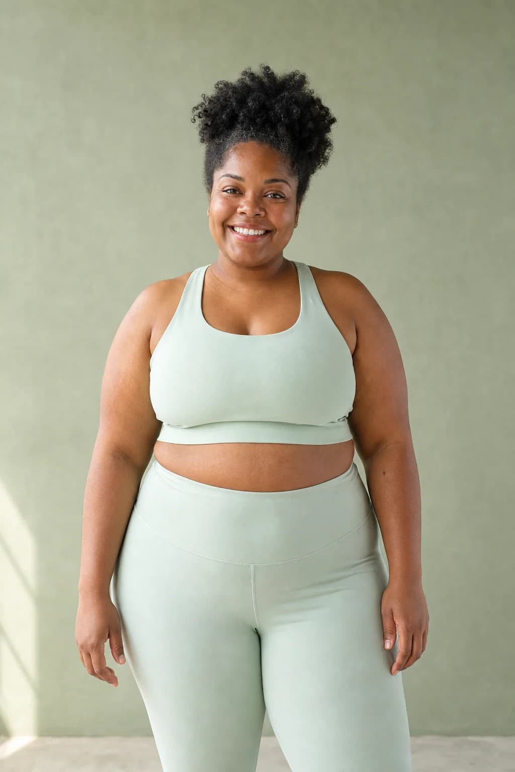 Adult woman in sage athletic clothing